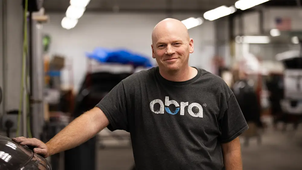 Abra Collision technician with a great smile